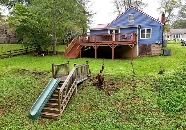 a front view of a house with garden