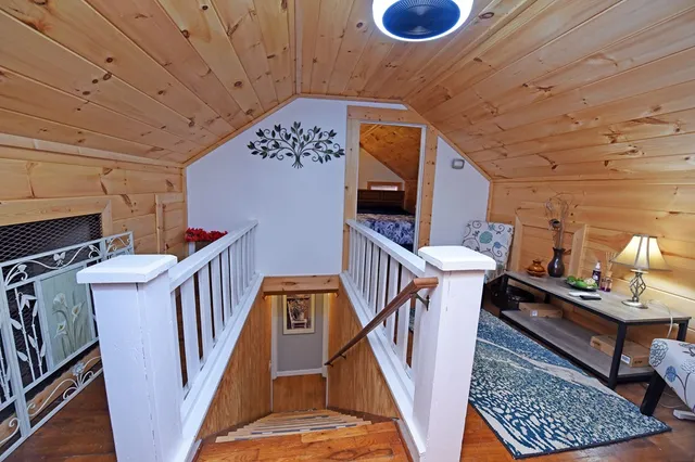 a view of a patio with table and chairs with wooden floor