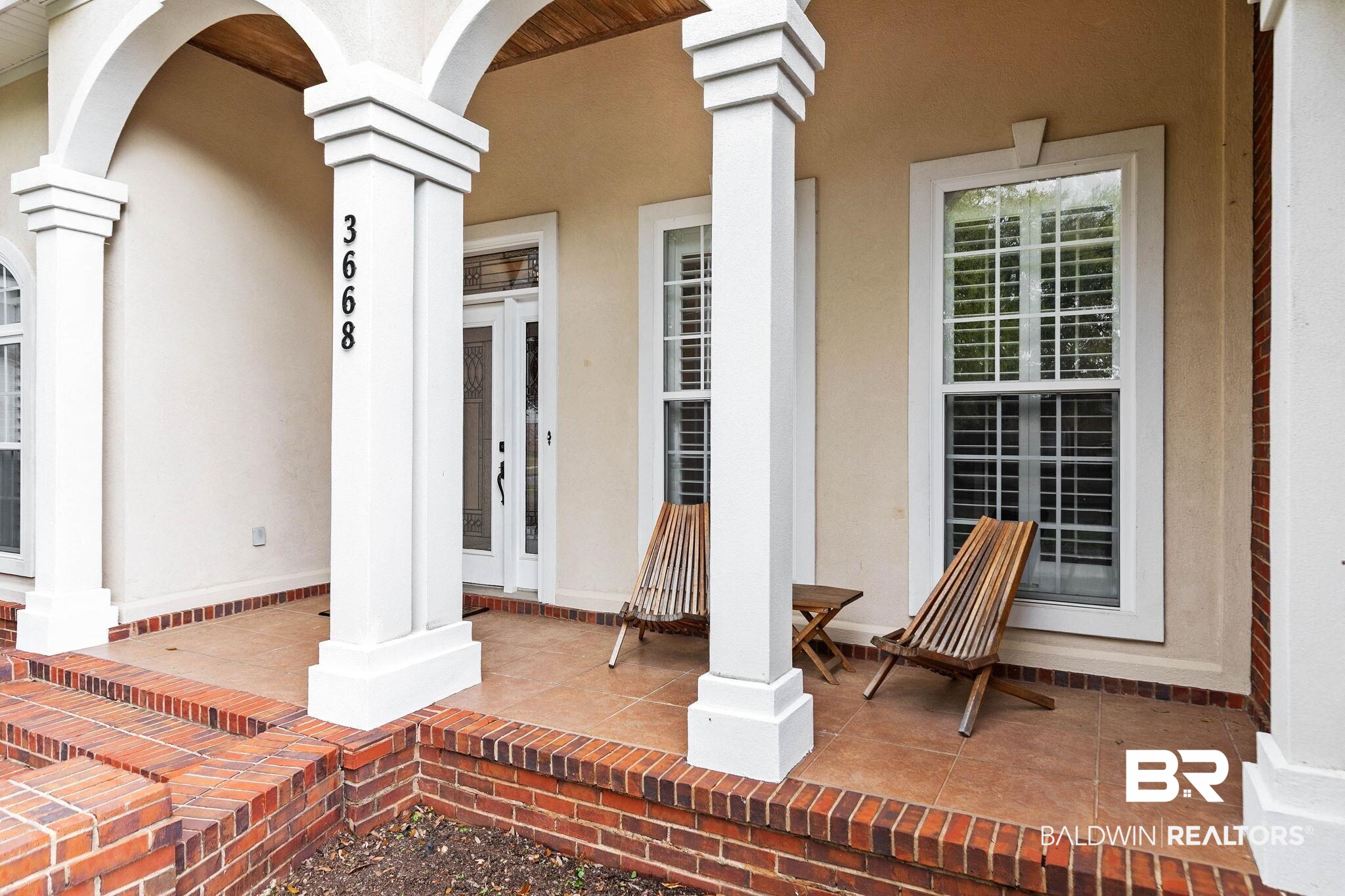 3668 Claridge Road North Mobile, AL 36608 - Photo 19 of 100 Property entrance featuring a porch, stucco siding, and french doors