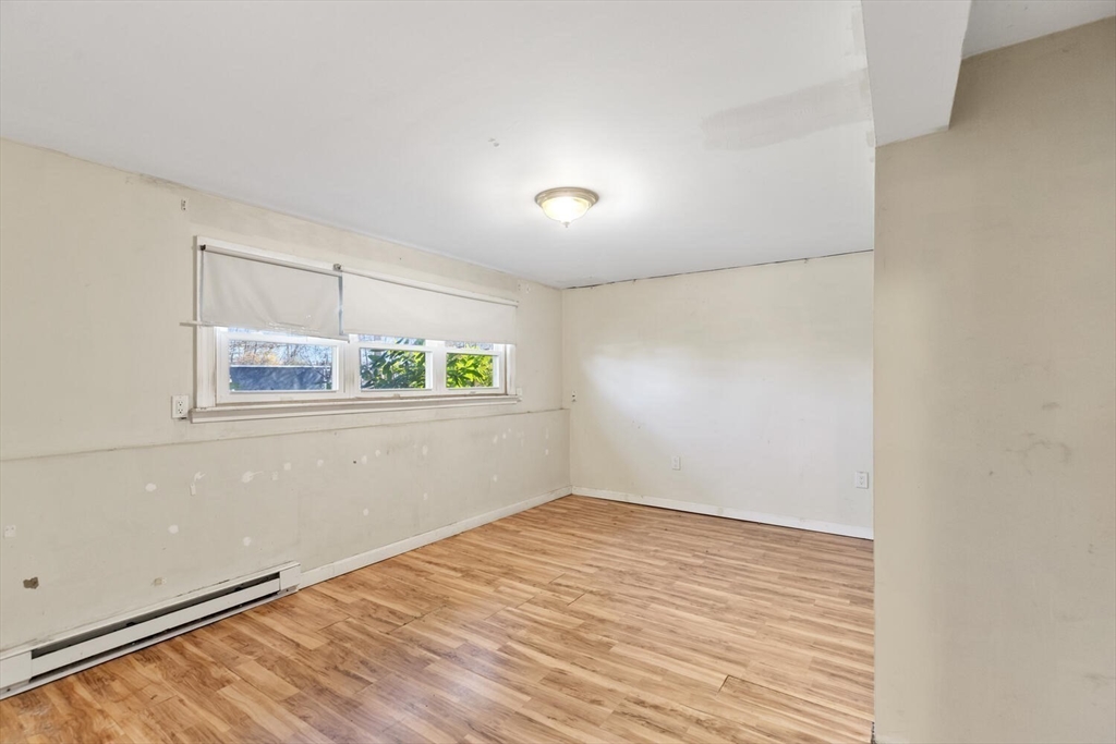 38 Valley Street Salem, MA 01970 - Photo 23 of 32 wooden floor in an empty room with a window