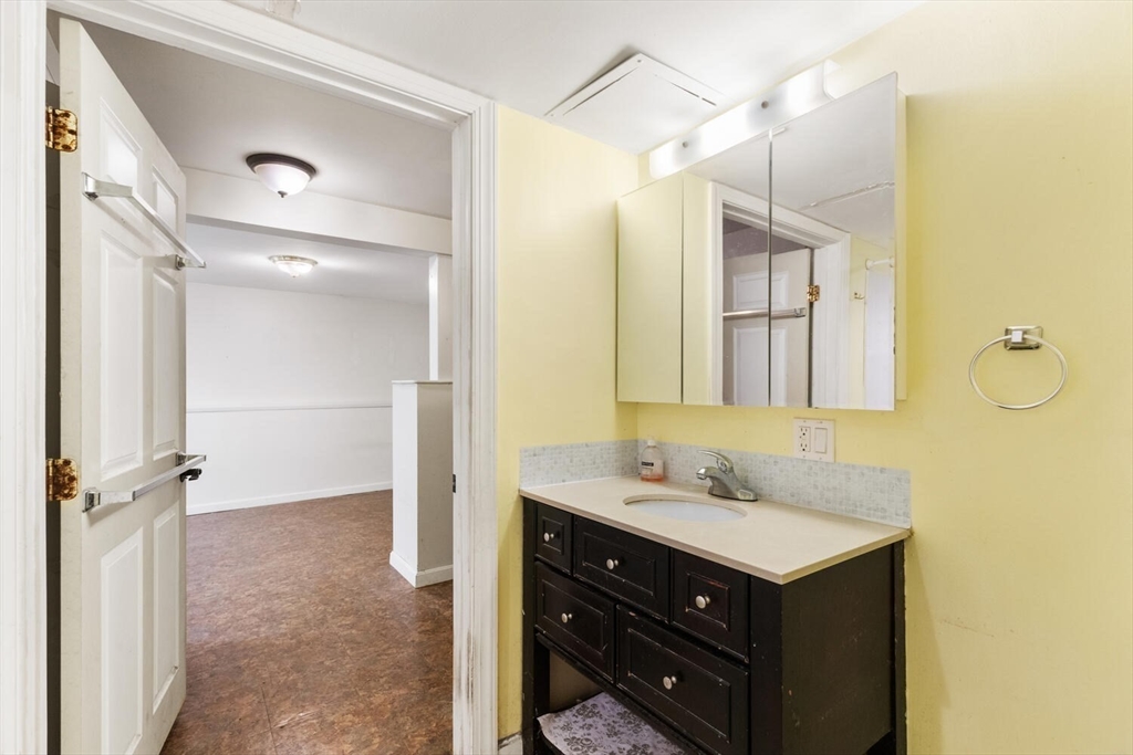 38 Valley Street Salem, MA 01970 - Photo 28 of 32 a bathroom with a sink mirror and a shower