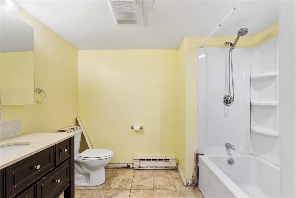 38 Valley Street Salem, MA 01970 - Photo 29 of 32 a bathroom with a granite countertop sink a toilet and shower