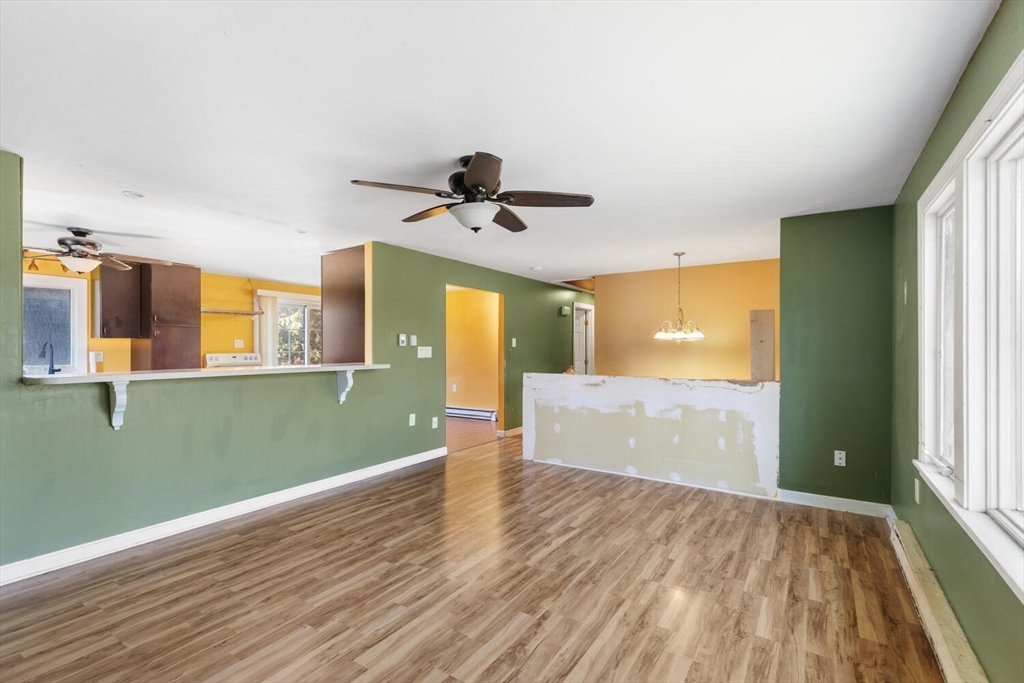 38 Valley Street Salem, MA 01970 - Photo 5 of 32 a view of a room with a ceiling fan window and wooden floor