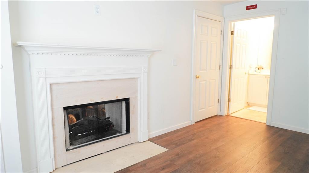 3275 Lenox Road Northeast, Unit 107 Atlanta, GA 30324 - Photo 15 of 18 a living room with a fireplace