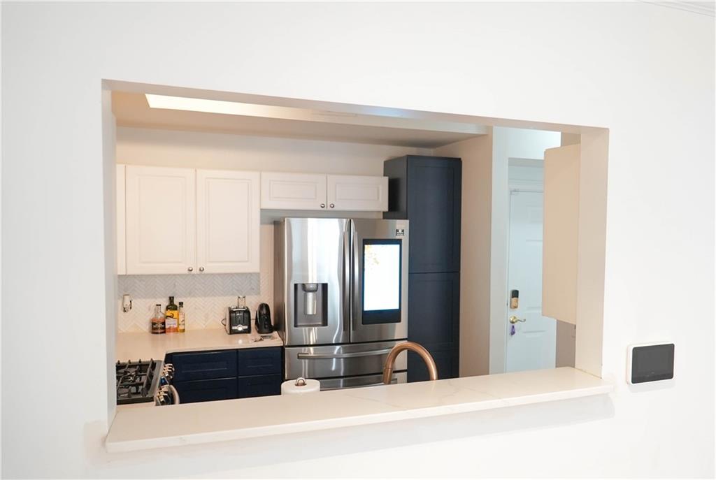 3275 Lenox Road Northeast, Unit 107 Atlanta, GA 30324 - Photo 5 of 18 a view of a living room with a sink