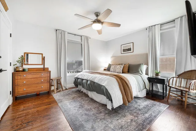a spacious bedroom with a bed and closet