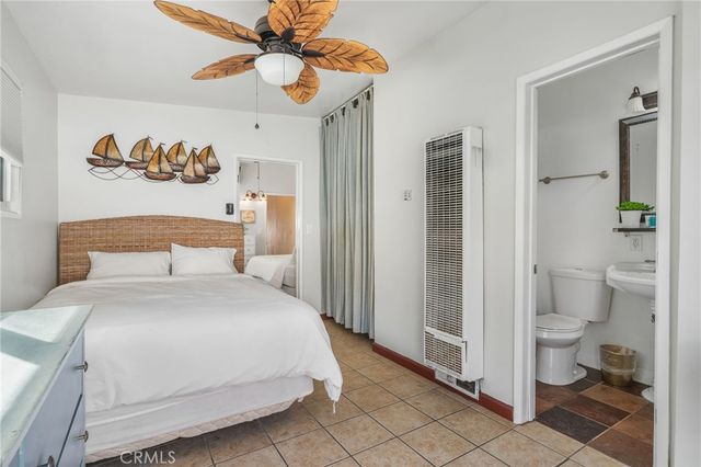 a bedroom with a bed and a view of bathroom