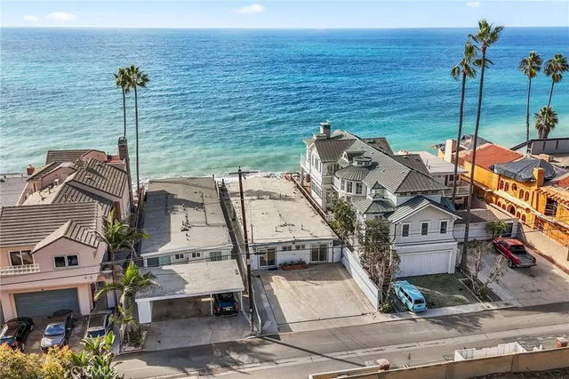 an aerial view of a house with a ocean view