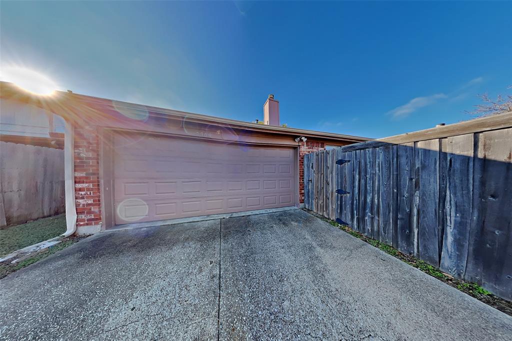 7709 Harbor Drive Rowlett, TX 75088 - Photo 17 of 19 a view of backyard with wooden fence