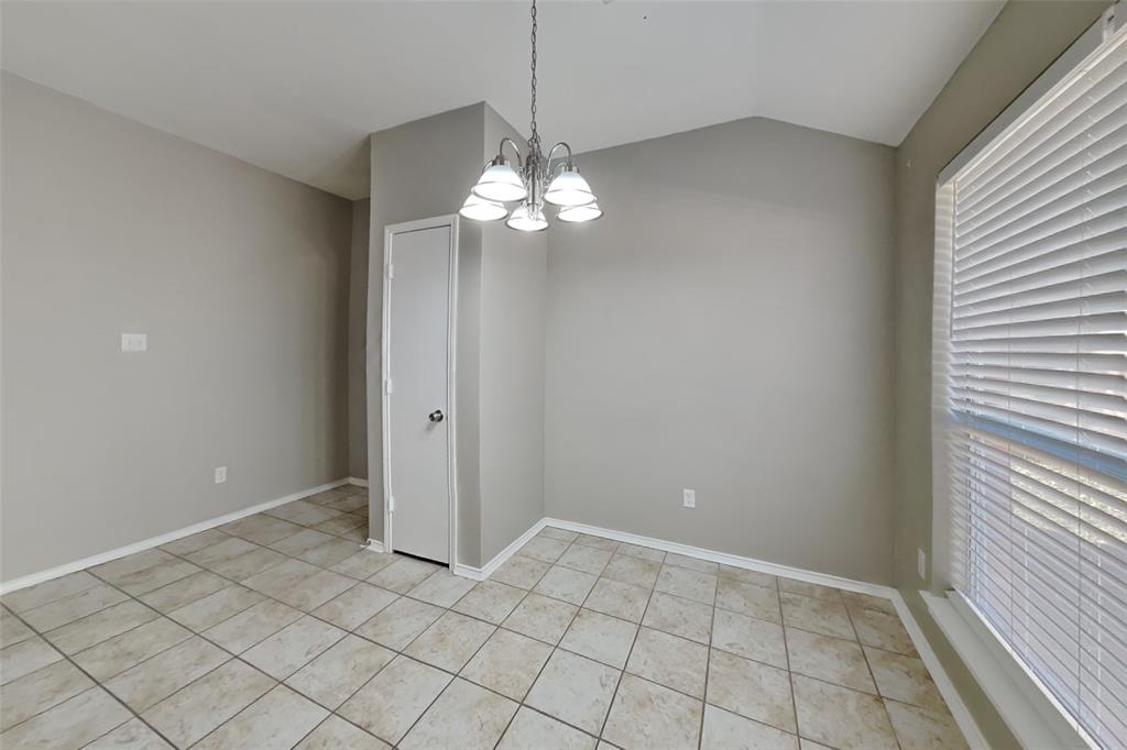 7709 Harbor Drive Rowlett, TX 75088 - Photo 7 of 19 a view of an empty room with chandelier fan