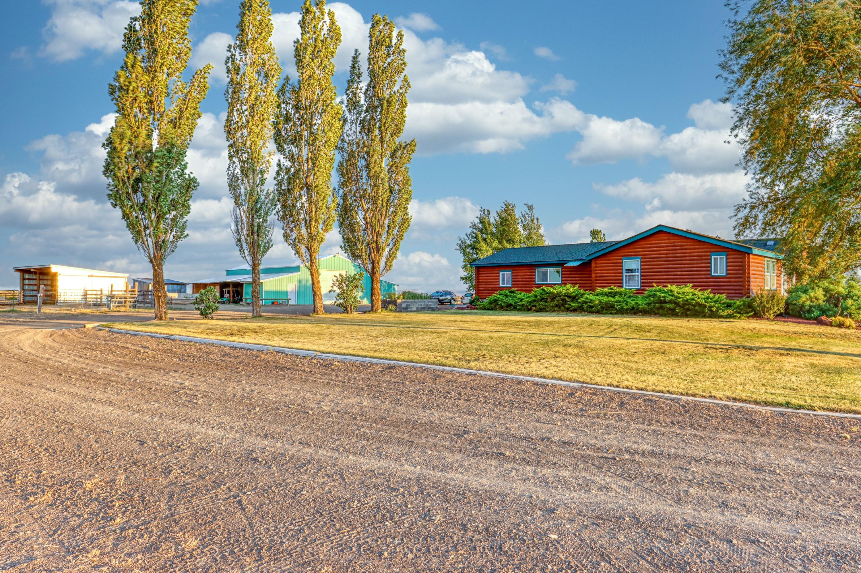 61143 Millican Road Christmas Valley, OR 97641 - Photo 4 of 29 Driveway wraps around to the back of this beautiful home
