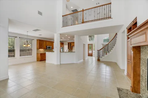 a view interior of residential house with wooden floor and a kitchen