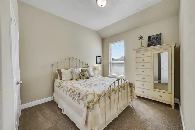 a bedroom with a bed and a cabinets