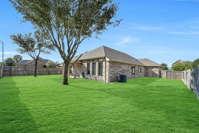 a view of a house with a big yard