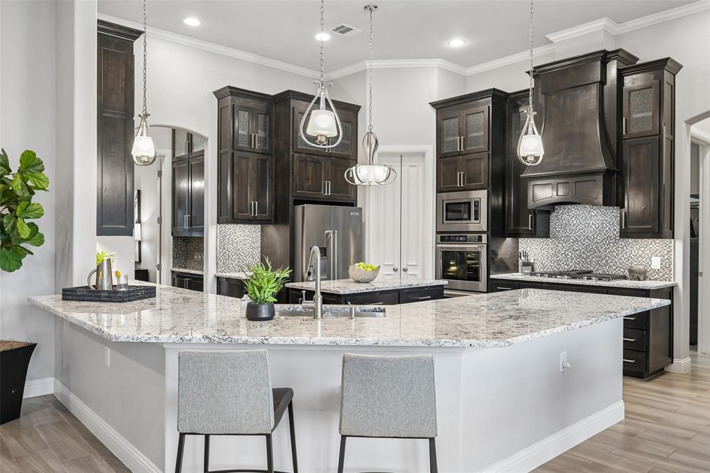 1657 Florence Road Keller, TX 76262 - Photo 16 of 40 a kitchen with stainless steel appliances granite countertop a sink and a refrigerator