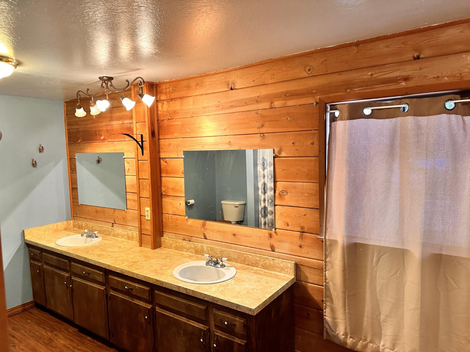34065 Shaver Springs Road Auberry, CA 93602 - Photo 6 of 13 a bathroom with a double vanity sink and a mirror