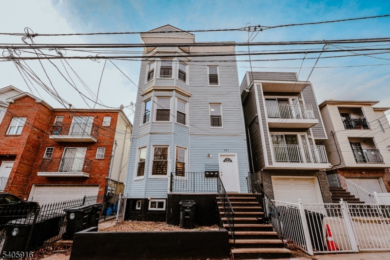 a front view of a building with a street