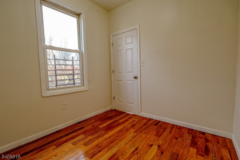 101 Hedden Terrace Newark, NJ 07108 - Photo 17 of 34 a view of a room with wooden floor and window