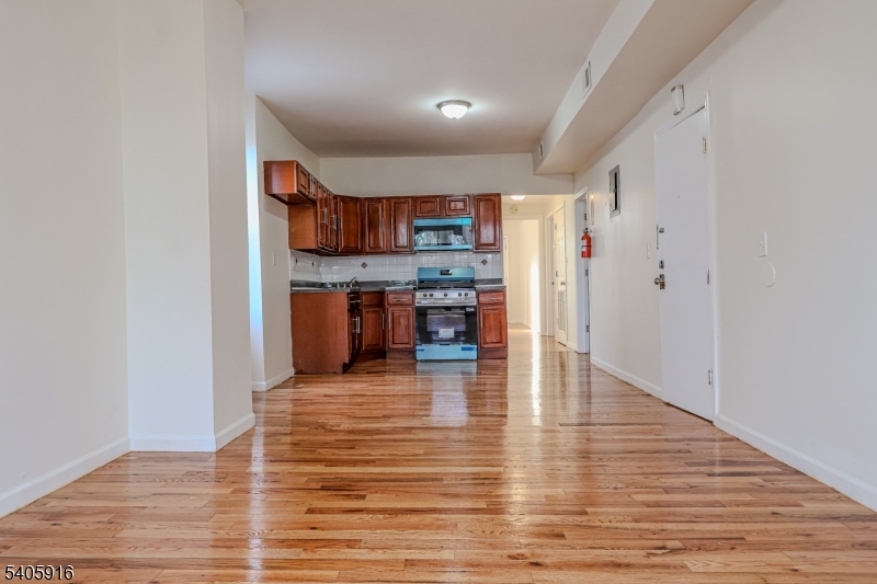 101 Hedden Terrace Newark, NJ 07108 - Photo 18 of 34 a view of a kitchen with kitchen island a counter top space and cabinets
