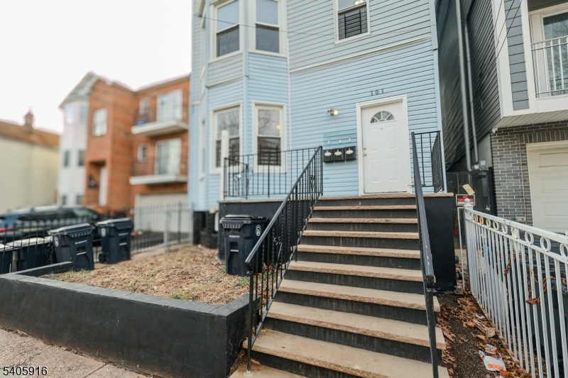 101 Hedden Terrace Newark, NJ 07108 - Photo 2 of 34 a view of a large building with wooden floor and fence