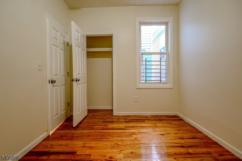 101 Hedden Terrace Newark, NJ 07108 - Photo 21 of 34 a view of a room with wooden floor and window