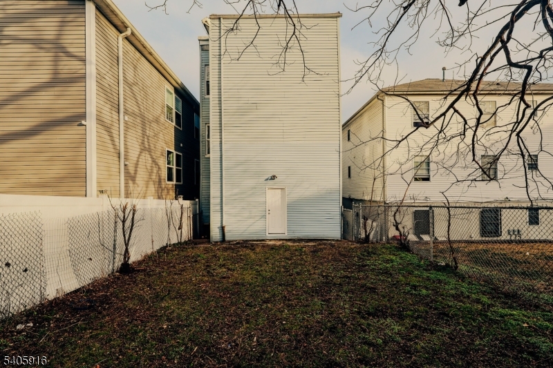 101 Hedden Terrace Newark, NJ 07108 - Photo 33 of 34 a front view of a house with a yard