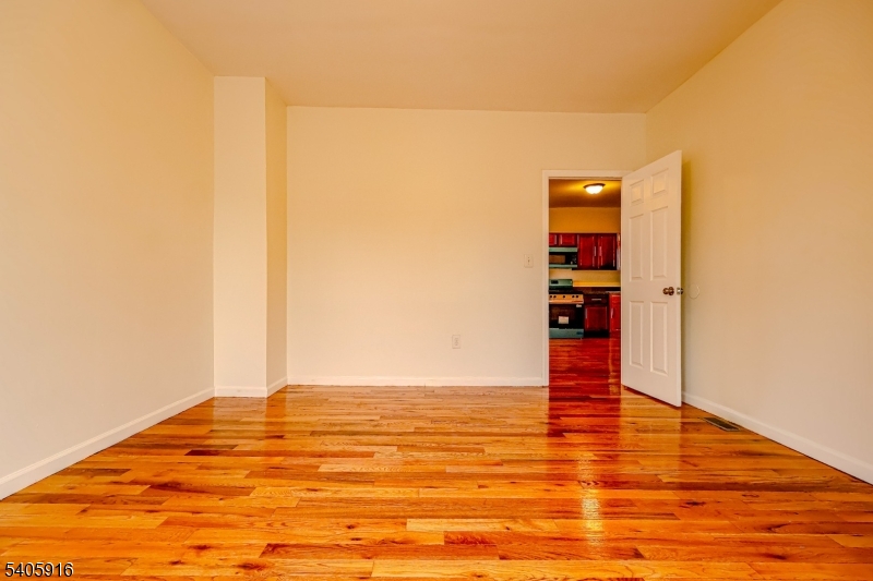 101 Hedden Terrace Newark, NJ 07108 - Photo 5 of 34 a view of empty room with wooden floor