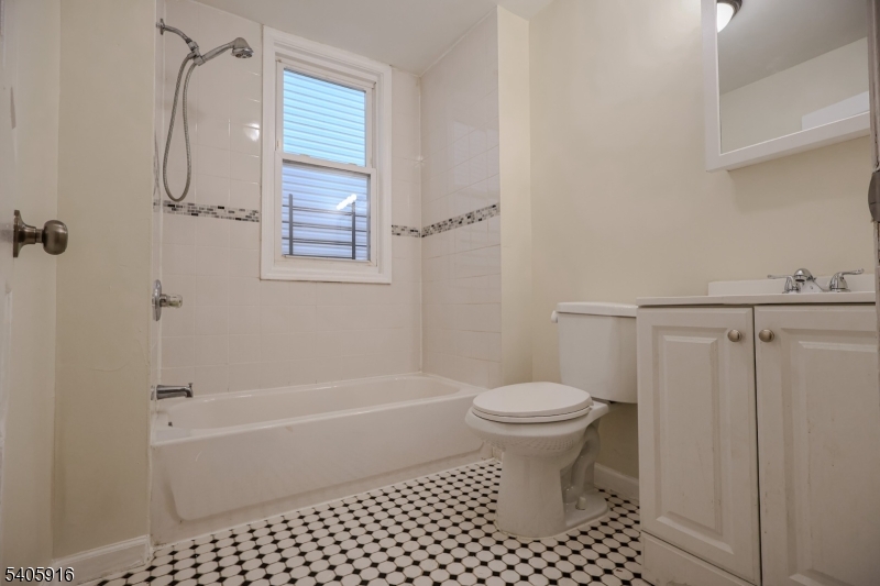 101 Hedden Terrace Newark, NJ 07108 - Photo 9 of 34 a bathroom with a toilet and a shower