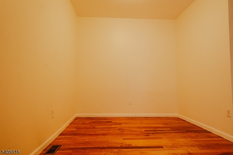 101 Hedden Terrace Newark, NJ 07108 - Photo 10 of 34 a view of empty room with wooden floor