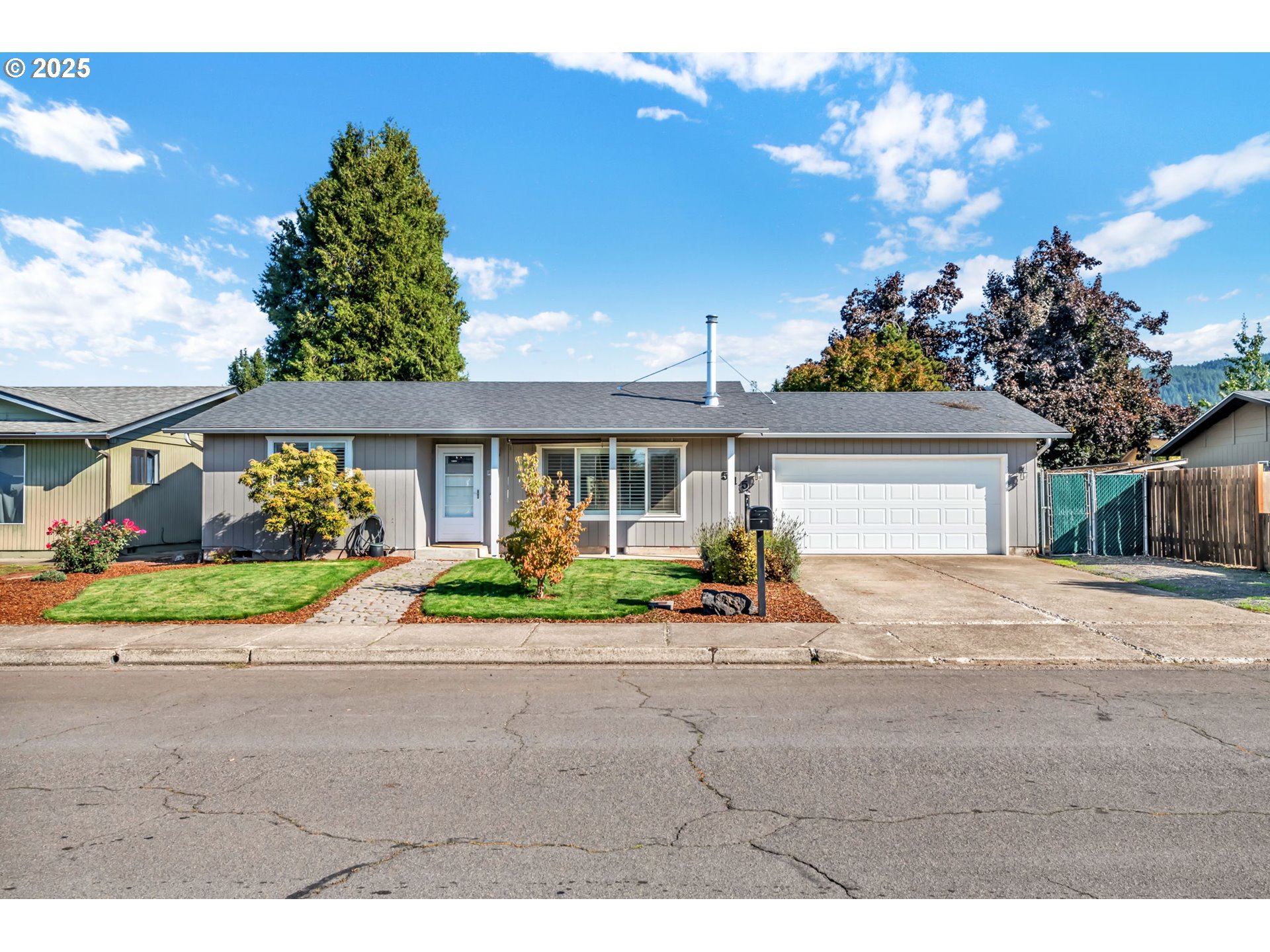 515 70th Street Springfield, OR 97478 - Photo 1 of 47 a front view of a house with garden