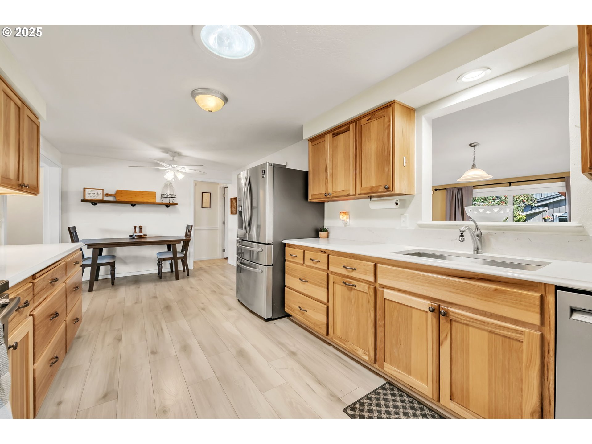 515 70th Street Springfield, OR 97478 - Photo 14 of 47 a kitchen with cabinets and wooden floor