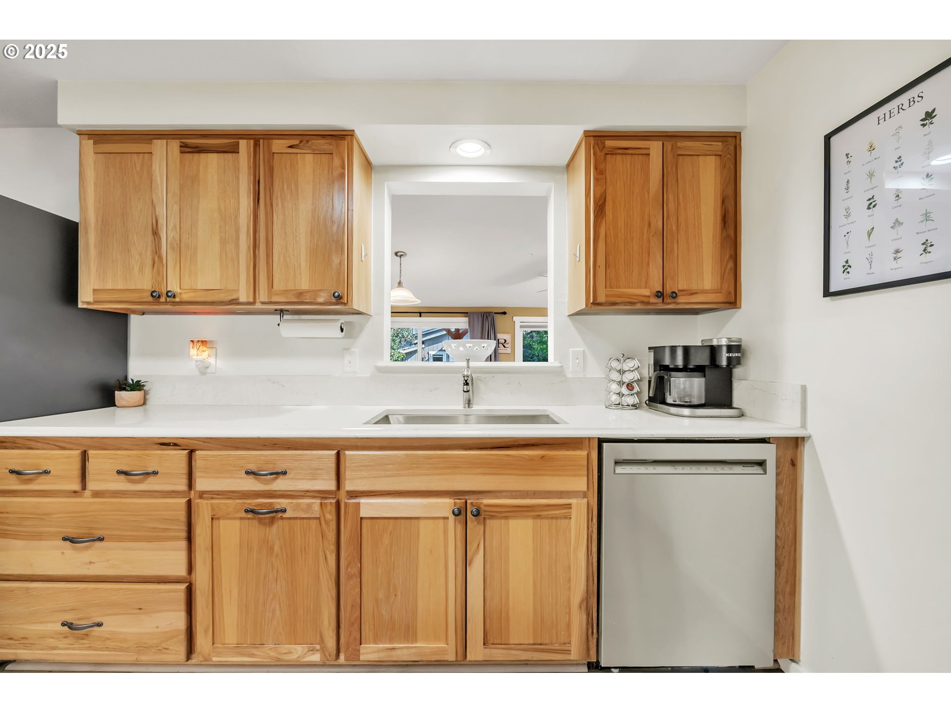 515 70th Street Springfield, OR 97478 - Photo 16 of 47 a kitchen with stainless steel appliances granite countertop a sink a stove and a refrigerator with wooden cabinets