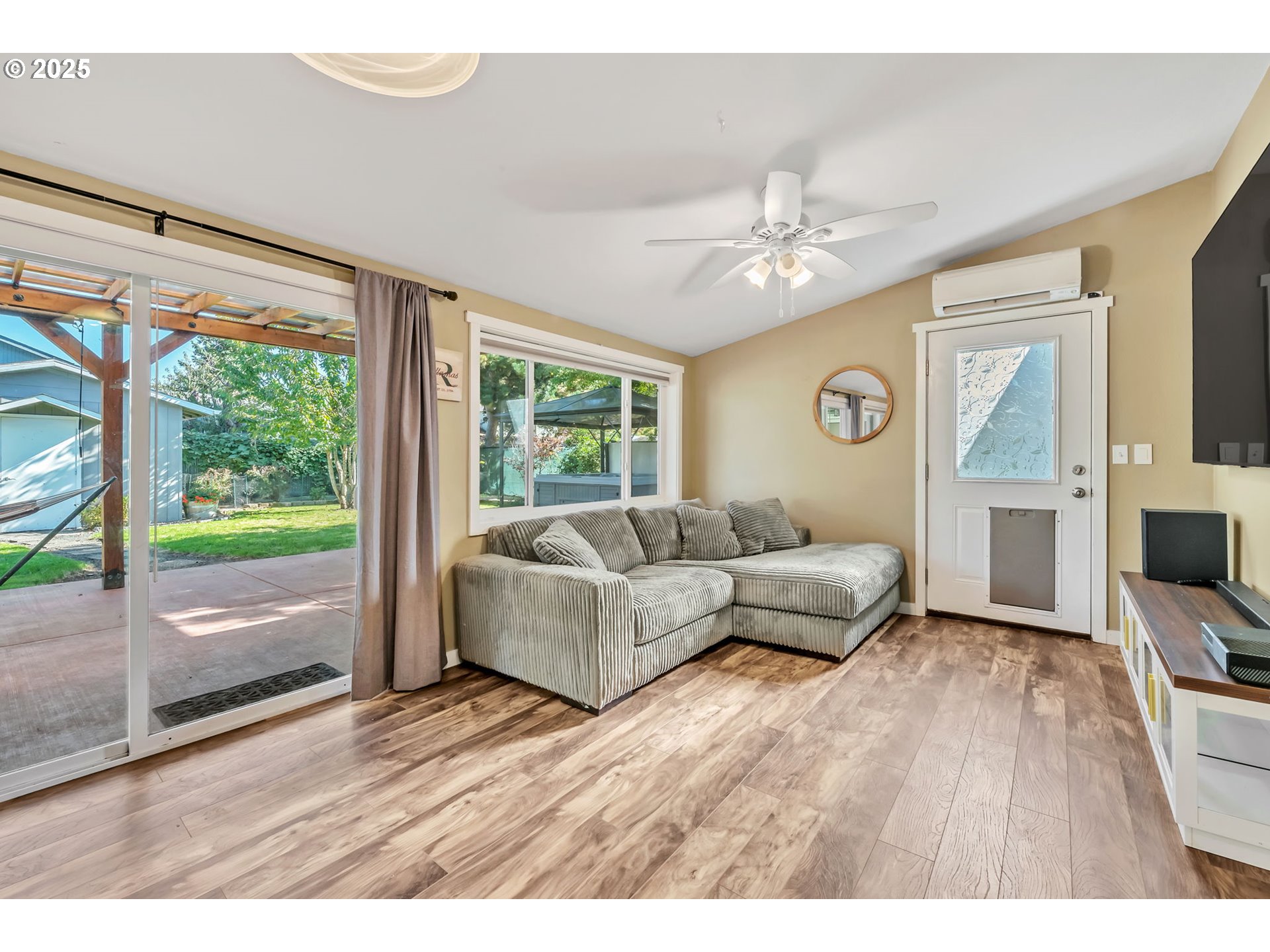 515 70th Street Springfield, OR 97478 - Photo 18 of 47 a living room with furniture and a flat screen tv