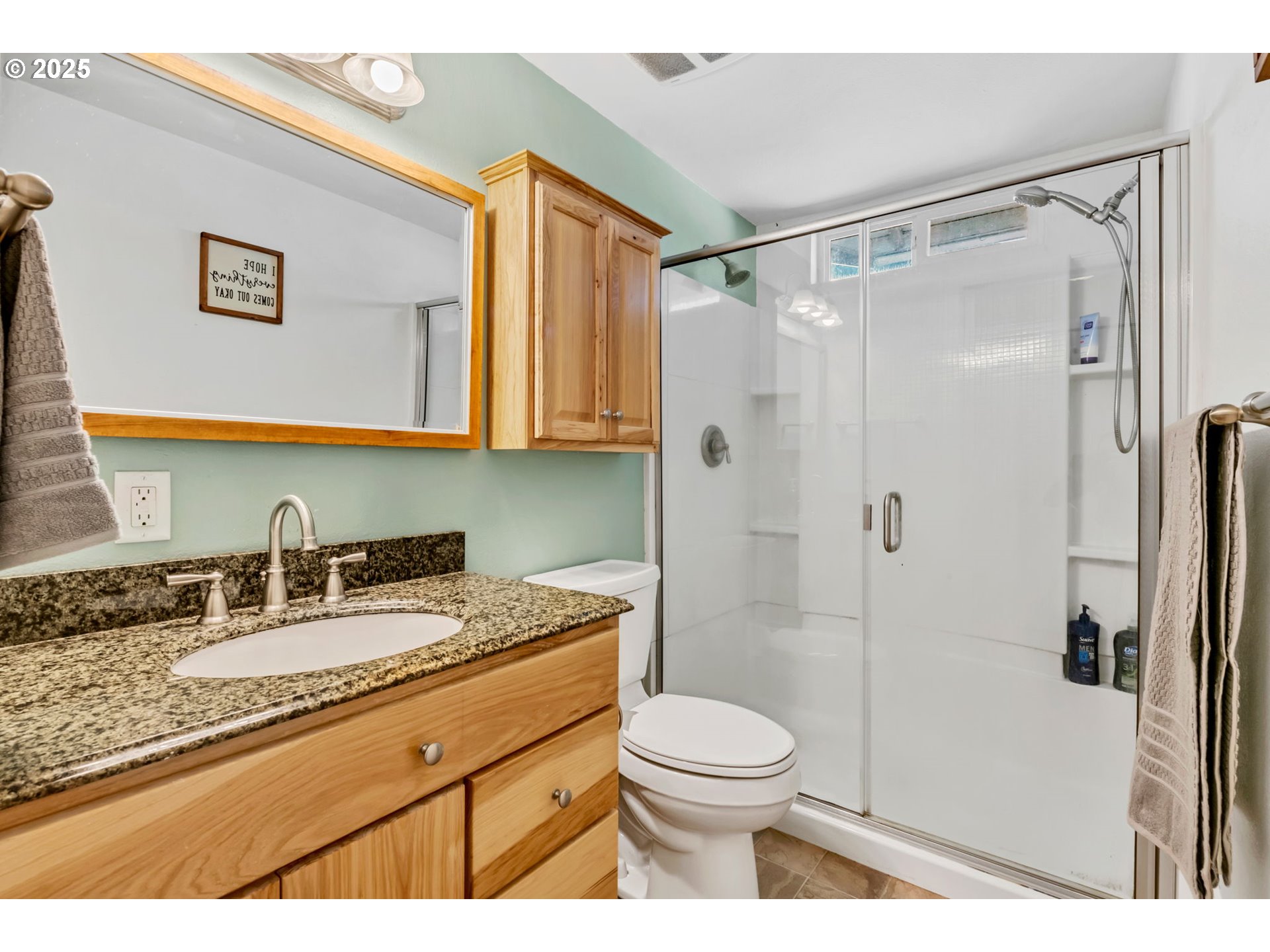 515 70th Street Springfield, OR 97478 - Photo 23 of 47 a bathroom with a granite countertop sink toilet and shower