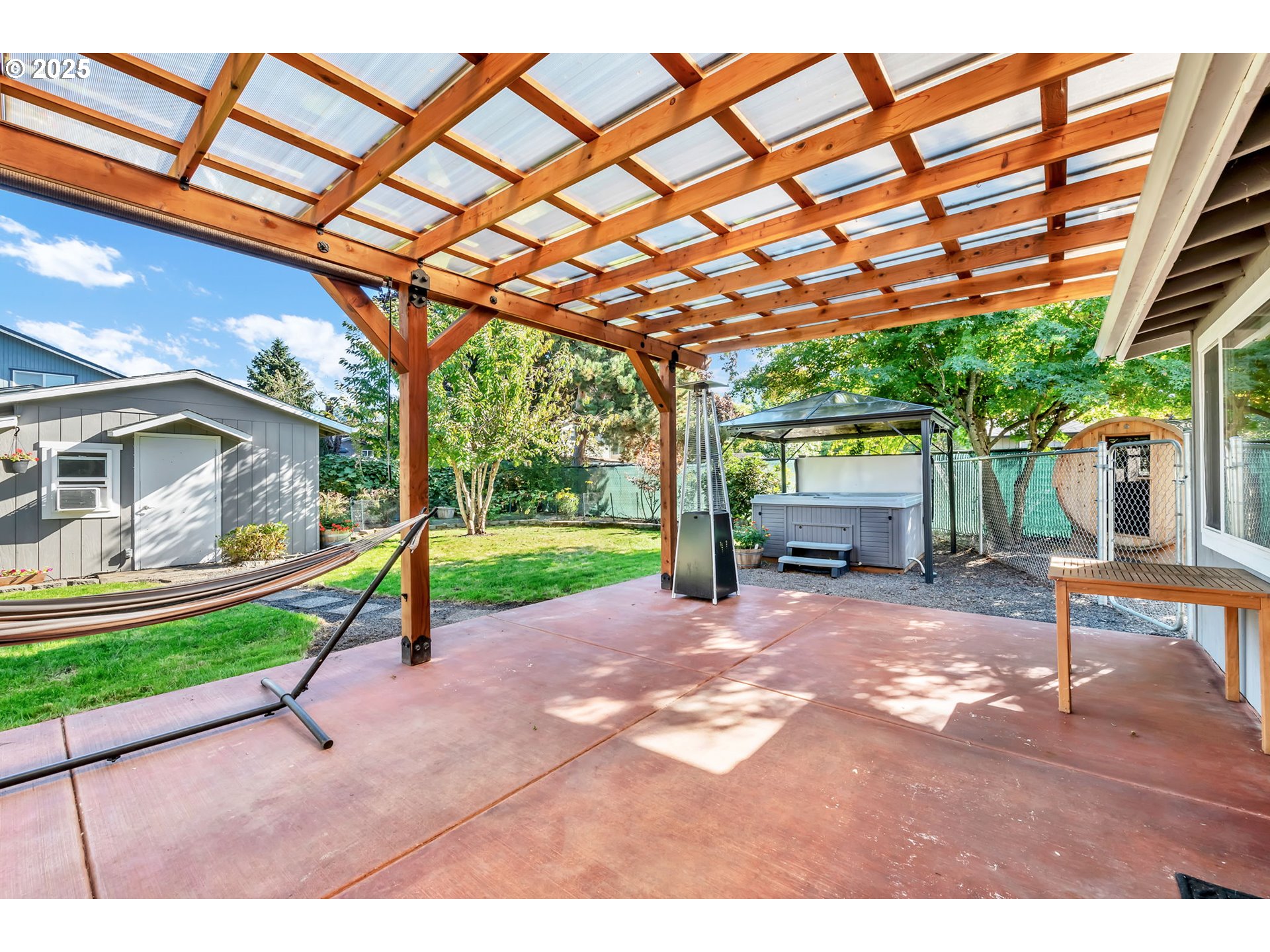 515 70th Street Springfield, OR 97478 - Photo 28 of 47 a view of a house with a backyard and a patio