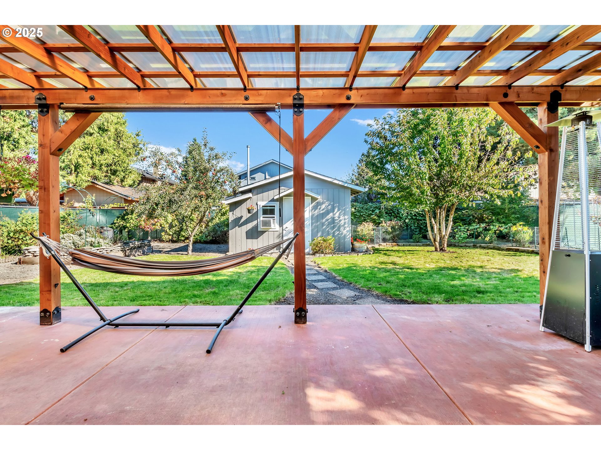 515 70th Street Springfield, OR 97478 - Photo 30 of 47 a blue sign that is sitting in front of a house with a yard