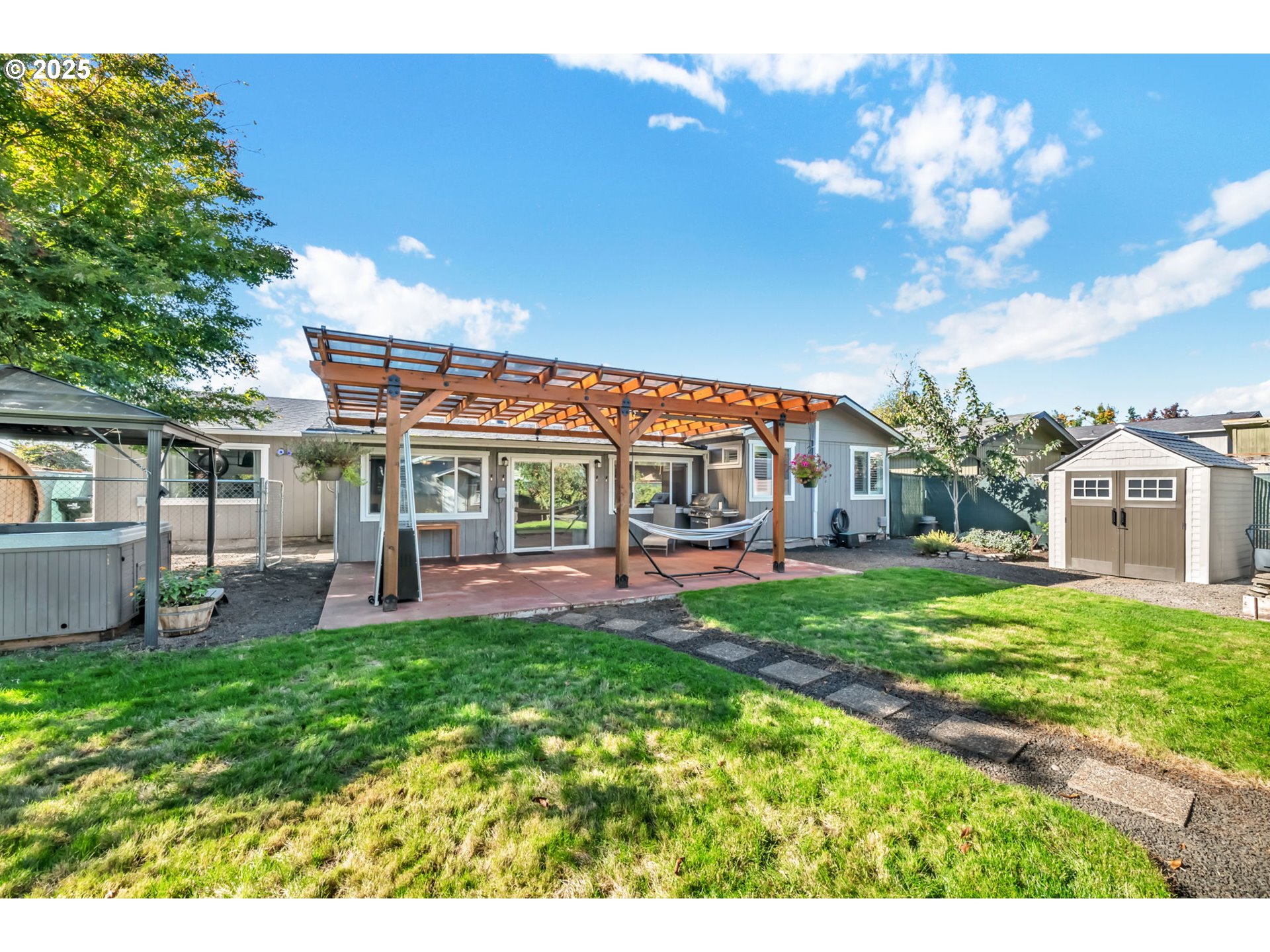 515 70th Street Springfield, OR 97478 - Photo 45 of 47 a view of a house with a yard porch and sitting area