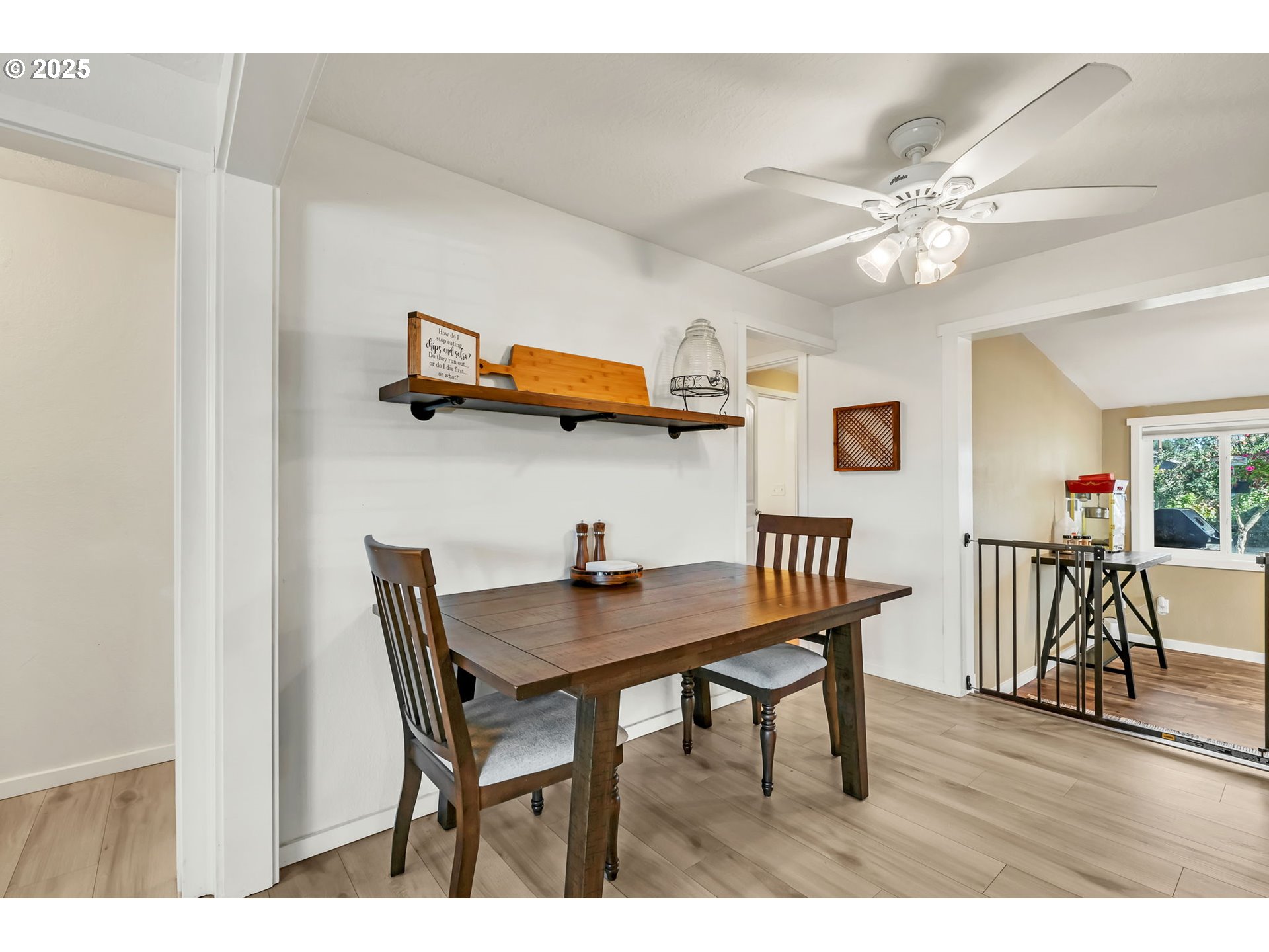 515 70th Street Springfield, OR 97478 - Photo 9 of 47 a view of a dining room with furniture and wooden floor