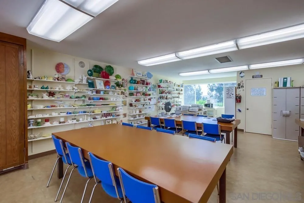 17617 Pomerado Road, Unit 215 San Diego, CA 92128 - Photo 62 of 64 a kitchen with a table and chairs in it