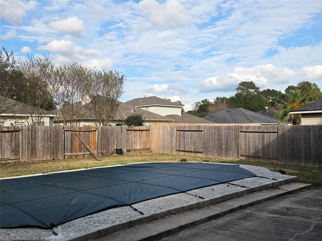a view of swimming pool with deck and lake view