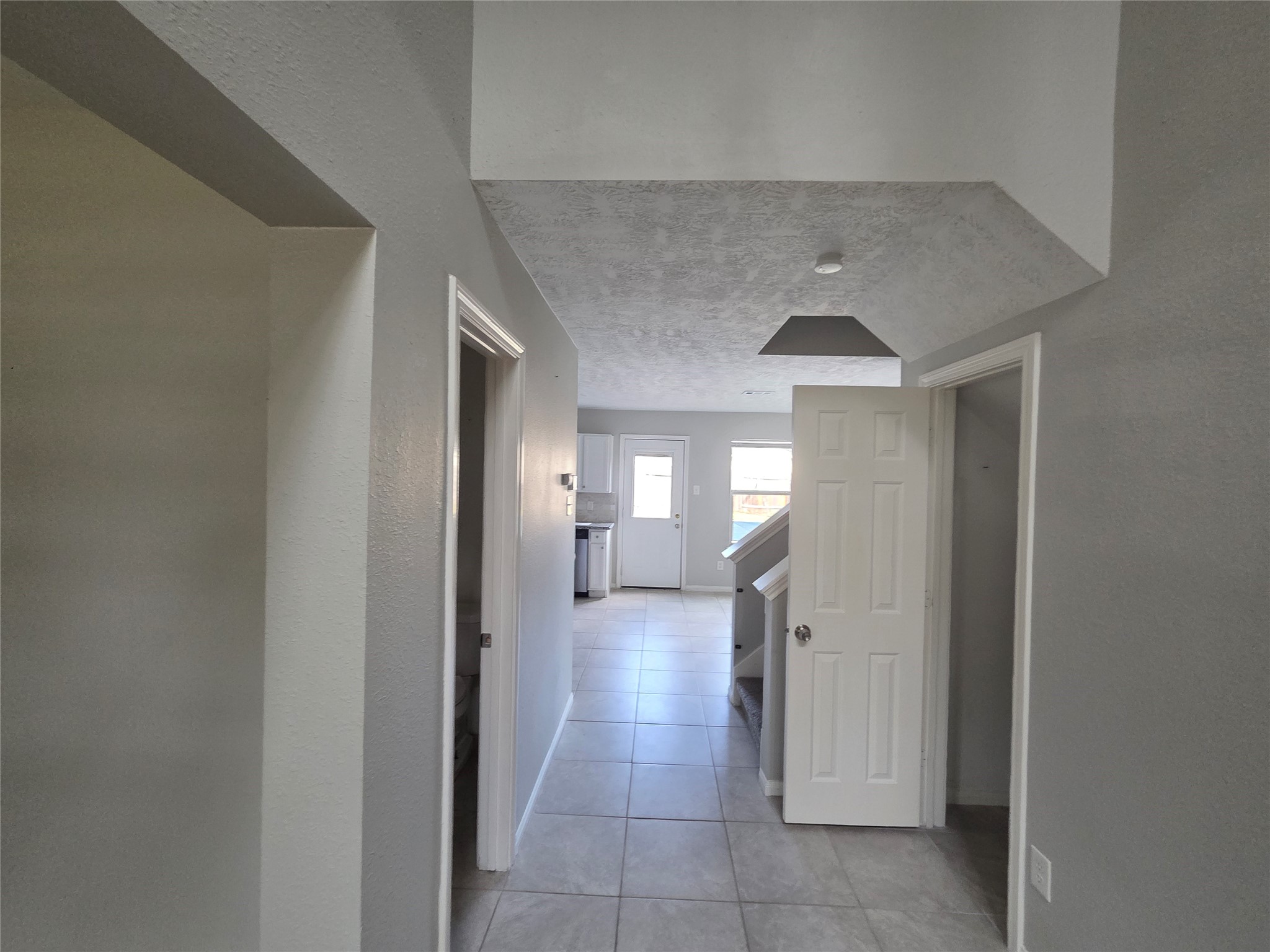 32018 Annice Lane Pinehurst, TX 77362 - Photo 5 of 19 Step into a welcoming entryway with a seamless flow leading directly to the bright, inviting kitchen, setting the stage for cozy gatherings and culinary adventures.