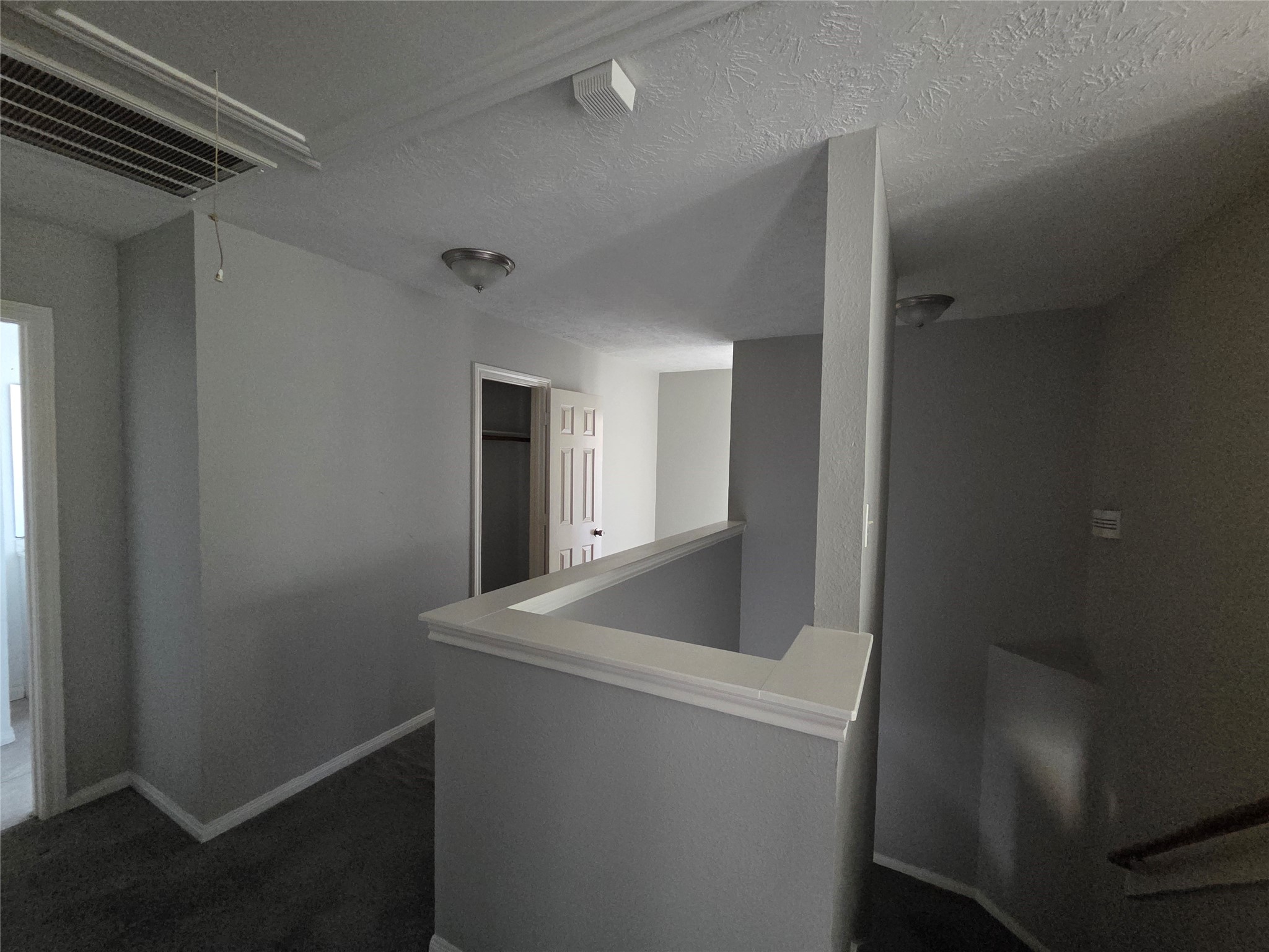 32018 Annice Lane Pinehurst, TX 77362 - Photo 7 of 19 This inviting upstairs landing seamlessly leads to the cozy bedrooms and modern bathrooms, offering a perfect blend of comfort and accessibility.