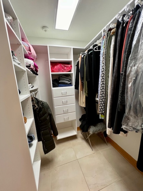 6738 Lakeridge Drive Long Grove, IL 60047 - Photo 15 of 23 a view of walk in closet with clothes and shoes