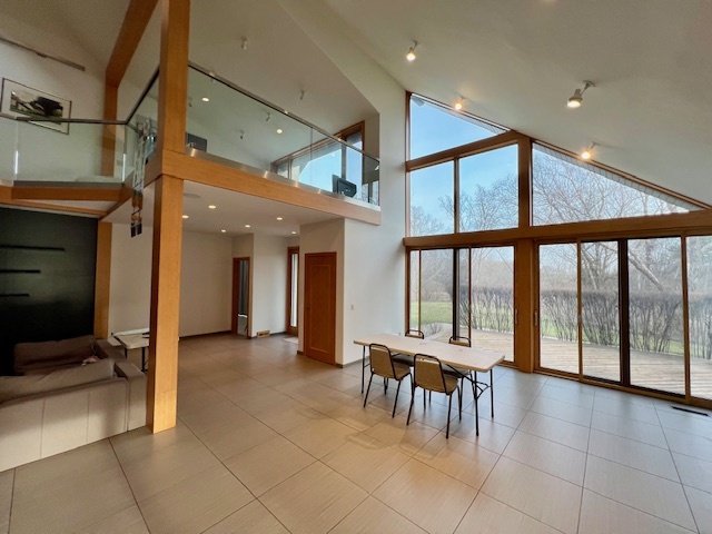 6738 Lakeridge Drive Long Grove, IL 60047 - Photo 17 of 23 a view of a hallway with furniture and a chandelier