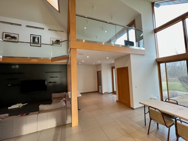 6738 Lakeridge Drive Long Grove, IL 60047 - Photo 18 of 23 a view of a hallway with furniture and a window