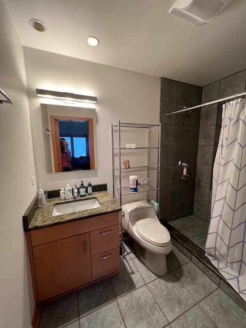 6738 Lakeridge Drive Long Grove, IL 60047 - Photo 8 of 23 a bathroom with a toilet sink and mirror