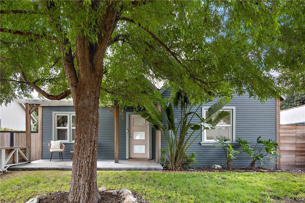 a front view of a house with garden