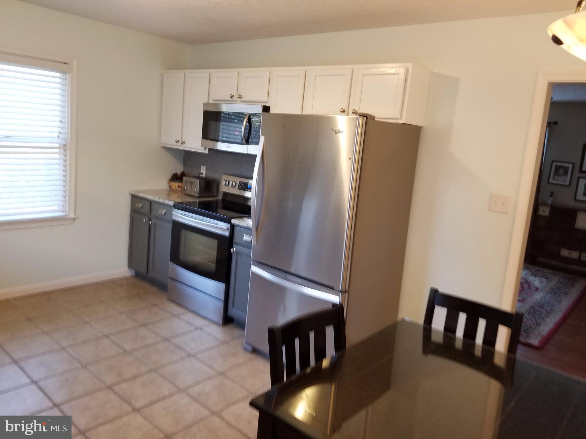 307 Raven Road Stephens City, VA 22655 - Photo 6 of 8 a kitchen with stainless steel appliances granite countertop a refrigerator stove top oven and sink