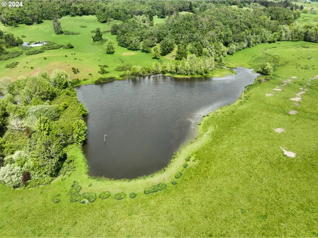 a view of a lake with a yard