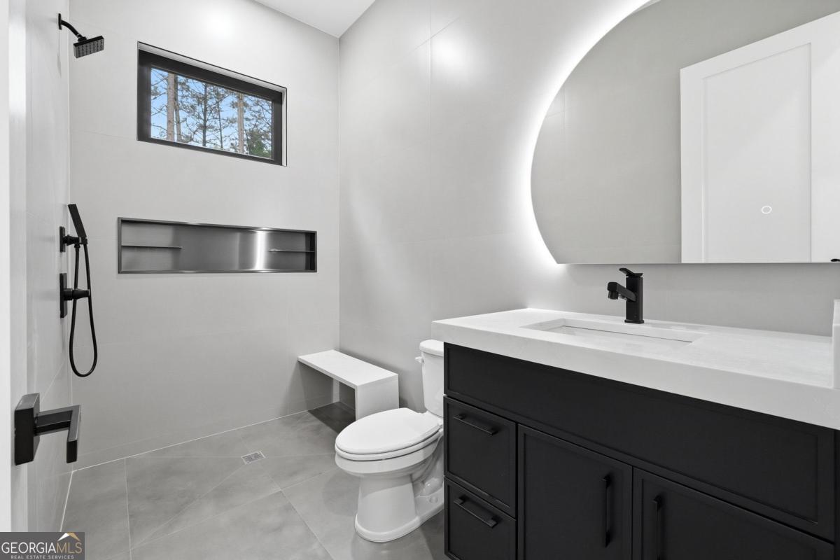 1563 Whitley Road Bethlehem, GA 30620 - Photo 35 of 44 a bathroom with a sink a toilet and shower